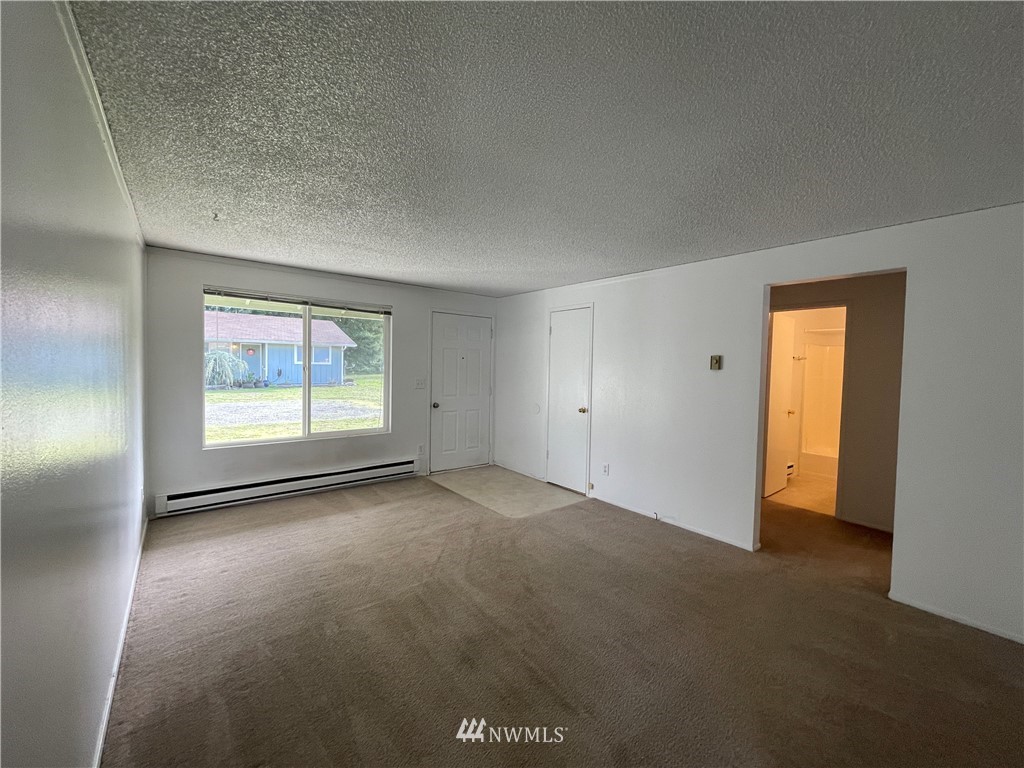 18404 Albany Street Southwest, Unit A & D Rochester, WA 98579 - Photo 15 of 19 an empty room with windows