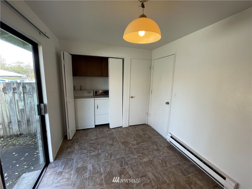 18404 Albany Street Southwest, Unit A & D Rochester, WA 98579 - Photo 18 of 19 an empty room with a window and chandelier