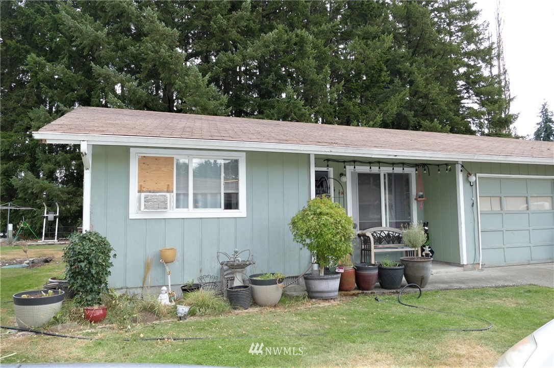 18404 Albany Street Southwest, Unit A & D Rochester, WA 98579 - Photo 3 of 19 a front view of a house with garden