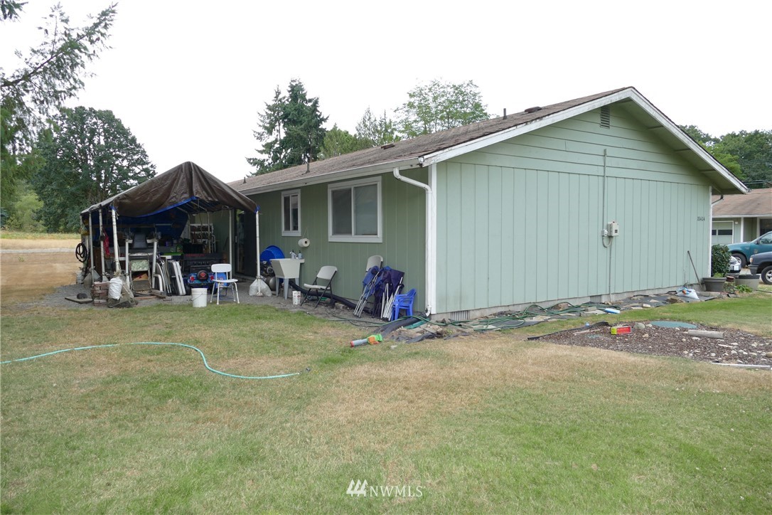 18404 Albany Street Southwest, Unit A & D Rochester, WA 98579 - Photo 4 of 19 a view of a house with backyard