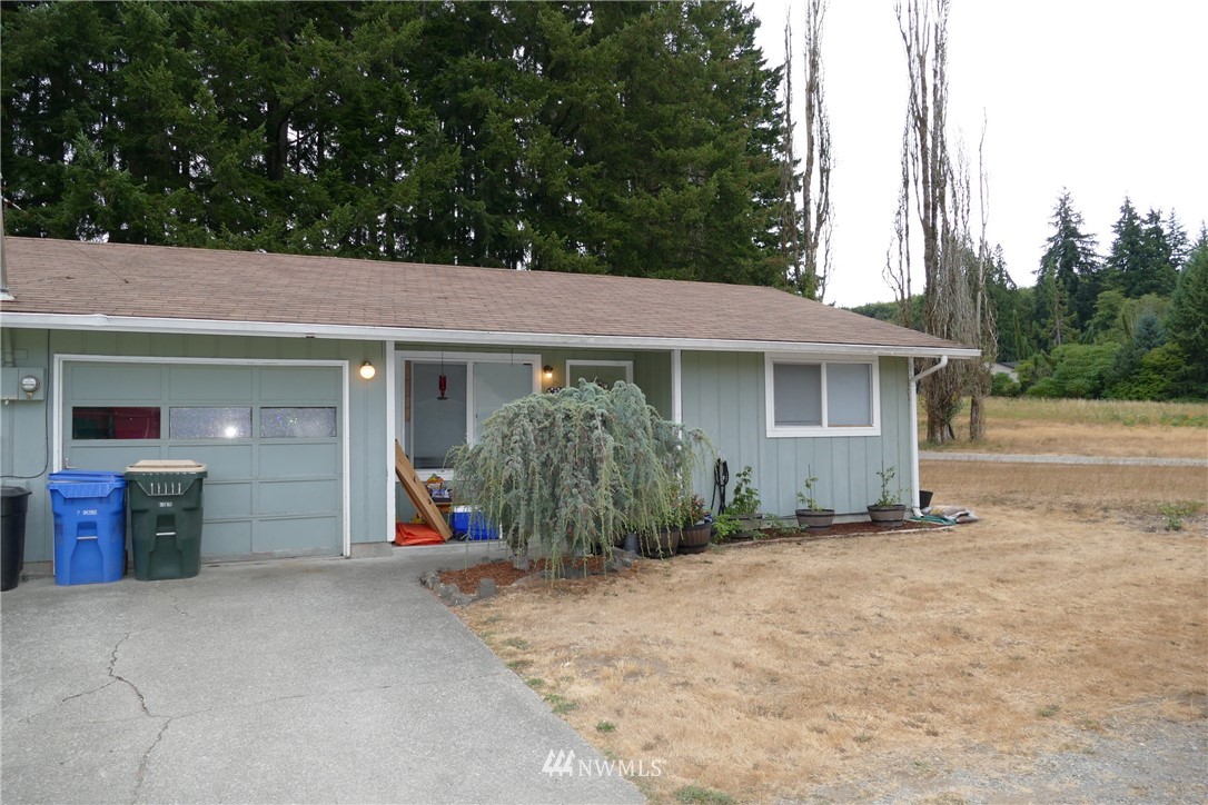 18404 Albany Street Southwest, Unit A & D Rochester, WA 98579 - Photo 6 of 19 front view of a house with a porch