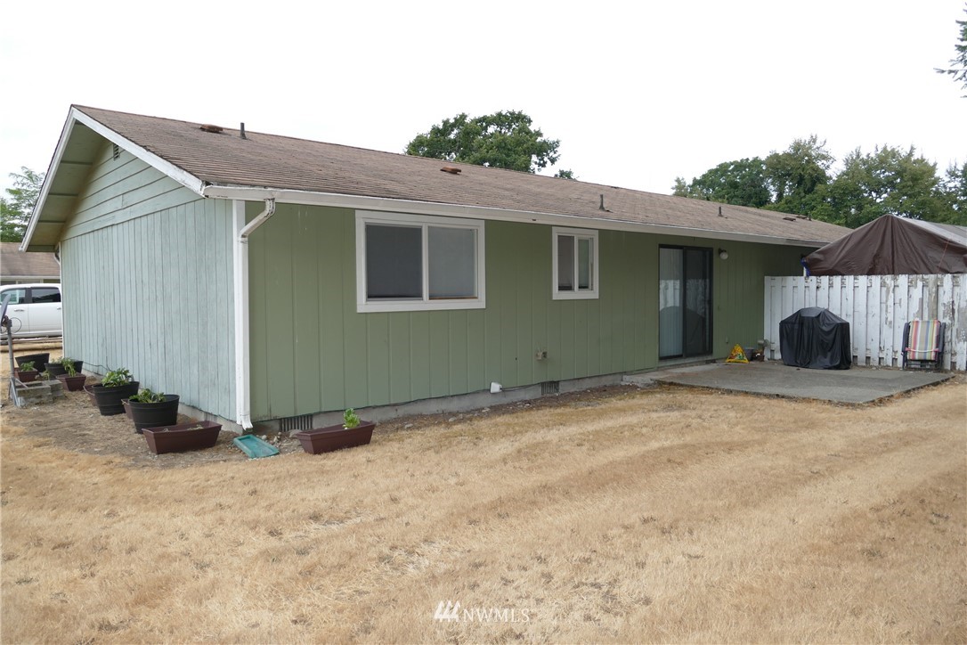 18404 Albany Street Southwest, Unit A & D Rochester, WA 98579 - Photo 7 of 19 a view of a house with backyard and trees