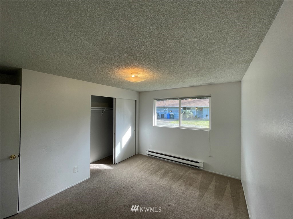 18404 Albany Street Southwest, Unit A & D Rochester, WA 98579 - Photo 9 of 19 an empty room with windows