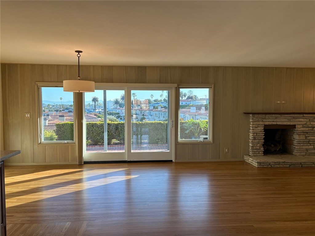 205 Pso De Suenos Redondo Beach, CA 90277 - Photo 13 of 34 a view of empty room with wooden floor and fireplace