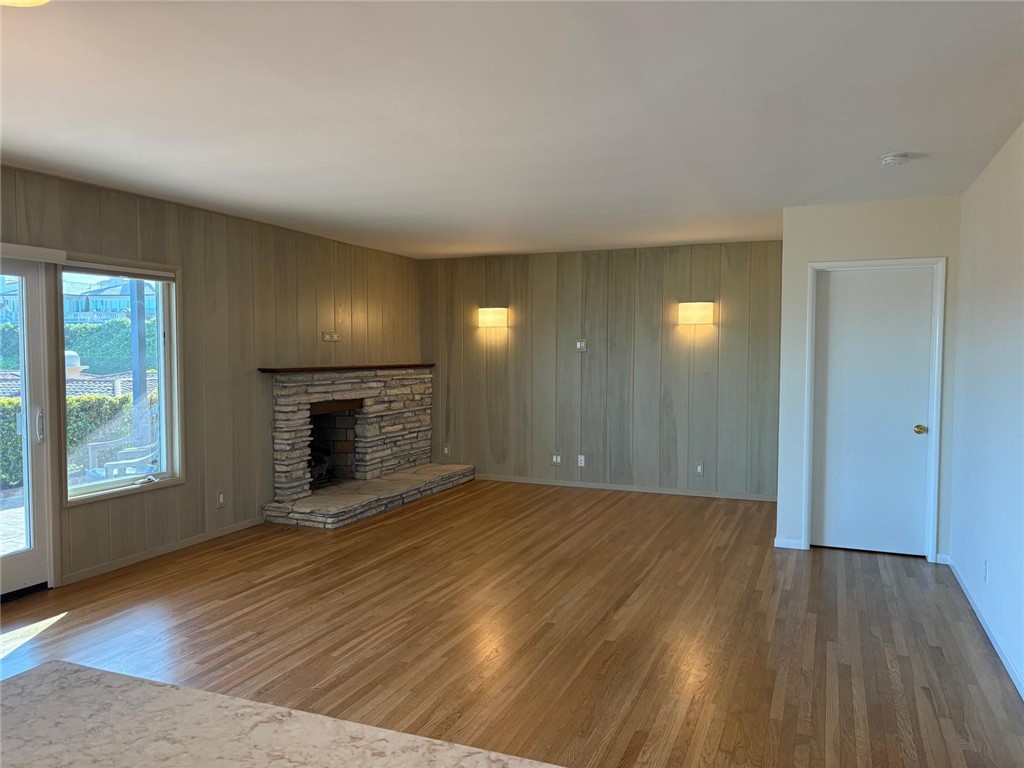 205 Pso De Suenos Redondo Beach, CA 90277 - Photo 14 of 34 a view of empty room with wooden floor and fireplace
