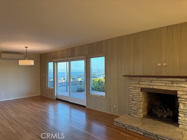 205 Pso De Suenos Redondo Beach, CA 90277 - Photo 17 of 34 a view of an empty room with window and wooden floor
