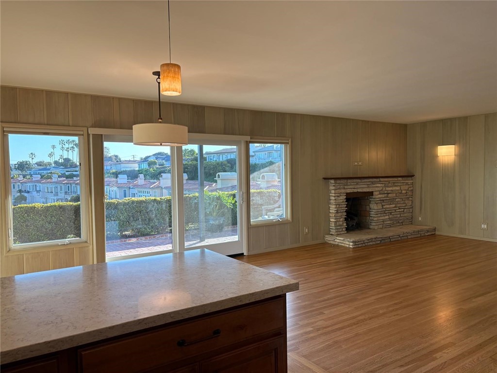 205 Pso De Suenos Redondo Beach, CA 90277 - Photo 18 of 34 a view of a livingroom with a fireplace and wooden floor