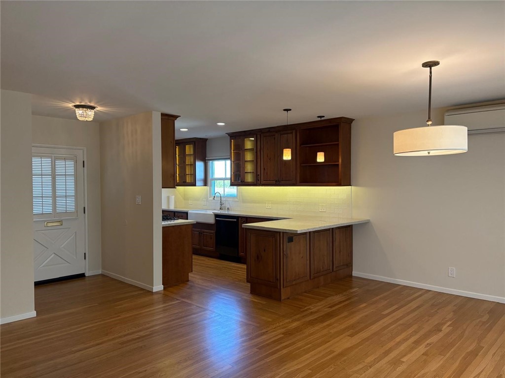 205 Pso De Suenos Redondo Beach, CA 90277 - Photo 19 of 34 a kitchen with a sink and chandelier