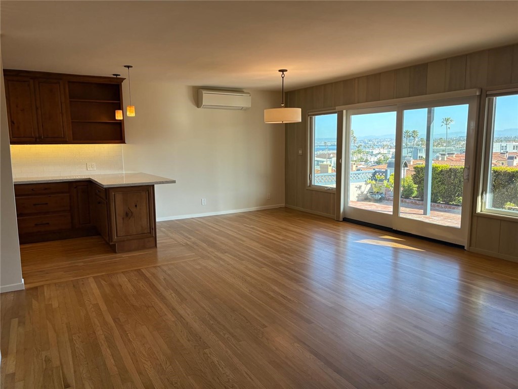 205 Pso De Suenos Redondo Beach, CA 90277 - Photo 20 of 34 a view of an empty room with wooden floor and a window