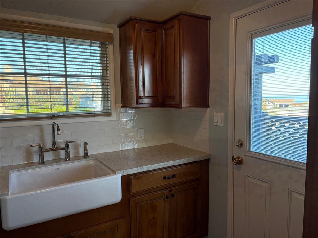 205 Pso De Suenos Redondo Beach, CA 90277 - Photo 24 of 34 a kitchen with a sink cabinets and a window