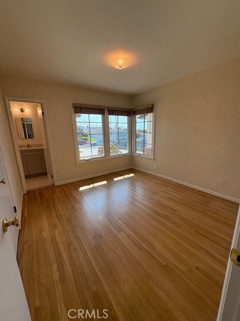 205 Pso De Suenos Redondo Beach, CA 90277 - Photo 28 of 34 an empty room with wooden floor and windows