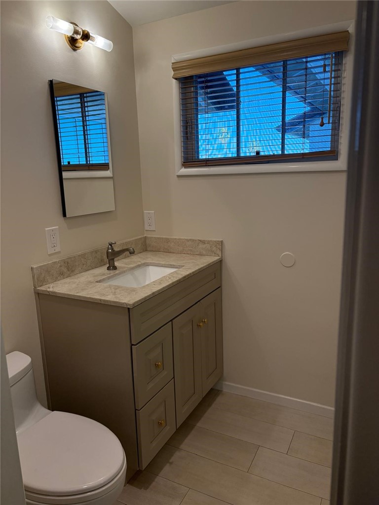 205 Pso De Suenos Redondo Beach, CA 90277 - Photo 31 of 34 a bathroom with a sink vanity mirror and toilet