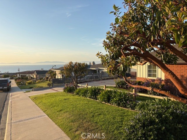 205 Pso De Suenos Redondo Beach, CA 90277 - Photo 9 of 34 view of a house with a yard