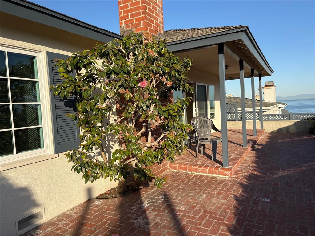 205 Pso De Suenos Redondo Beach, CA 90277 - Photo 10 of 34 a view of a house with a yard