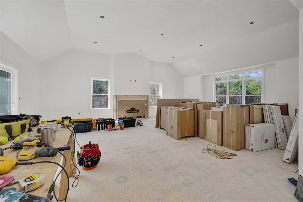 18 MacDonald Drive Boxford, MA 01921 - Photo 16 of 38 a view of a livingroom with furniture and a fireplace