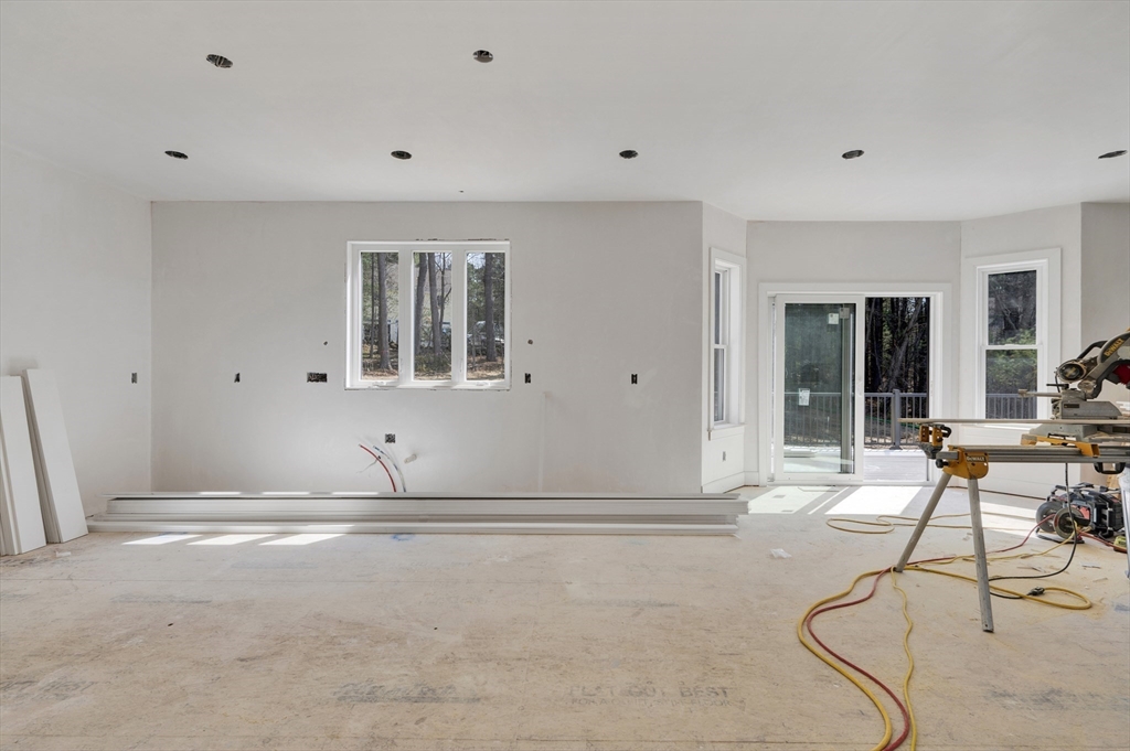 18 MacDonald Drive Boxford, MA 01921 - Photo 19 of 38 a room with gym equipment and view of living room