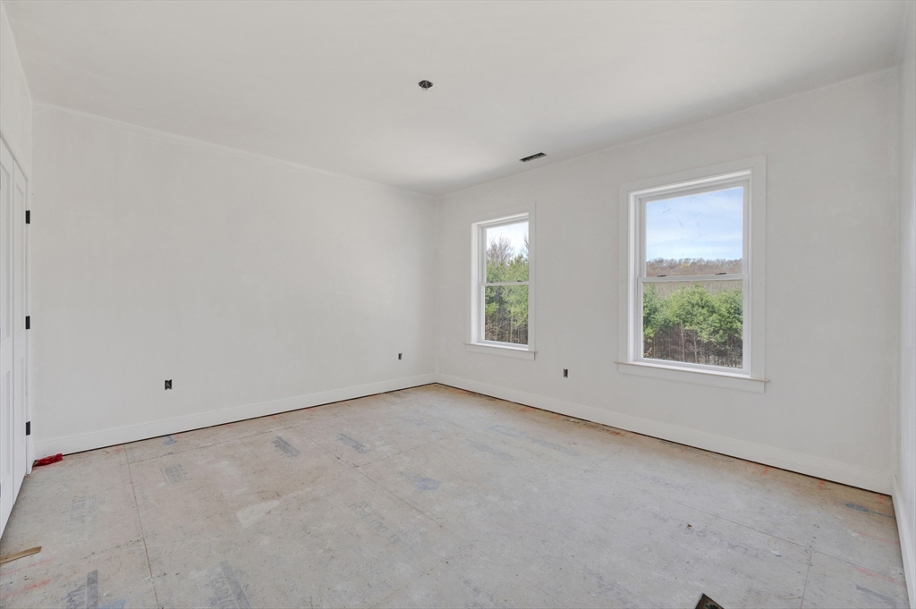 18 MacDonald Drive Boxford, MA 01921 - Photo 27 of 38 an empty room with windows