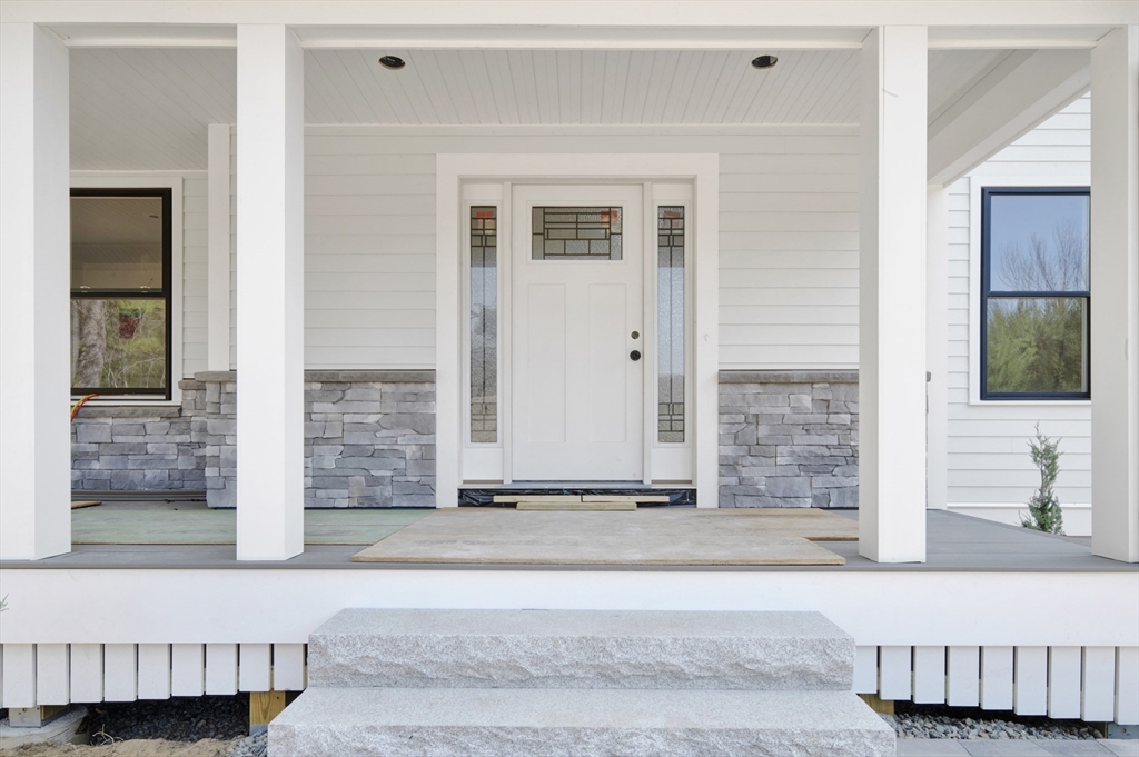 18 MacDonald Drive Boxford, MA 01921 - Photo 4 of 38 a living room with a couch and a rug