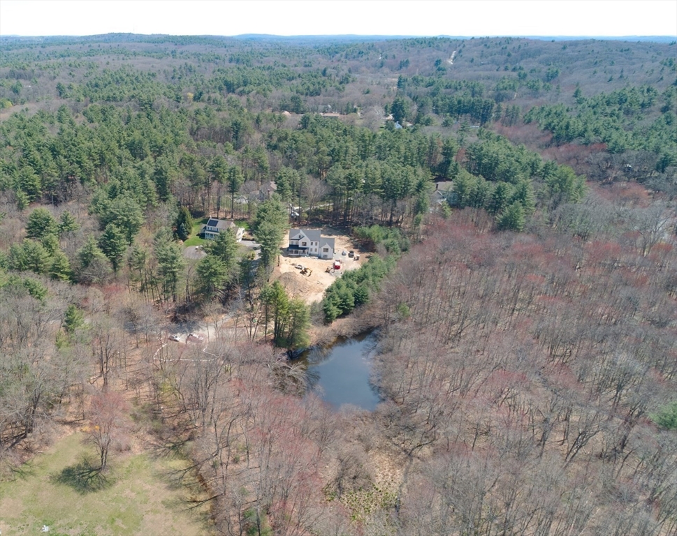 18 MacDonald Drive Boxford, MA 01921 - Photo 8 of 38 a view of a dry field with trees