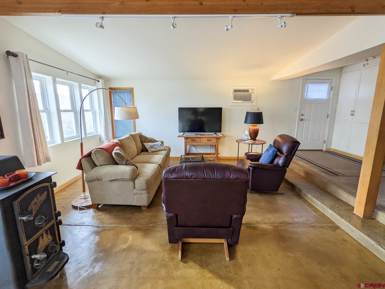 6733 2050th Road Delta, CO 81416 - Photo 2 of 32 a living room with furniture and a flat screen tv