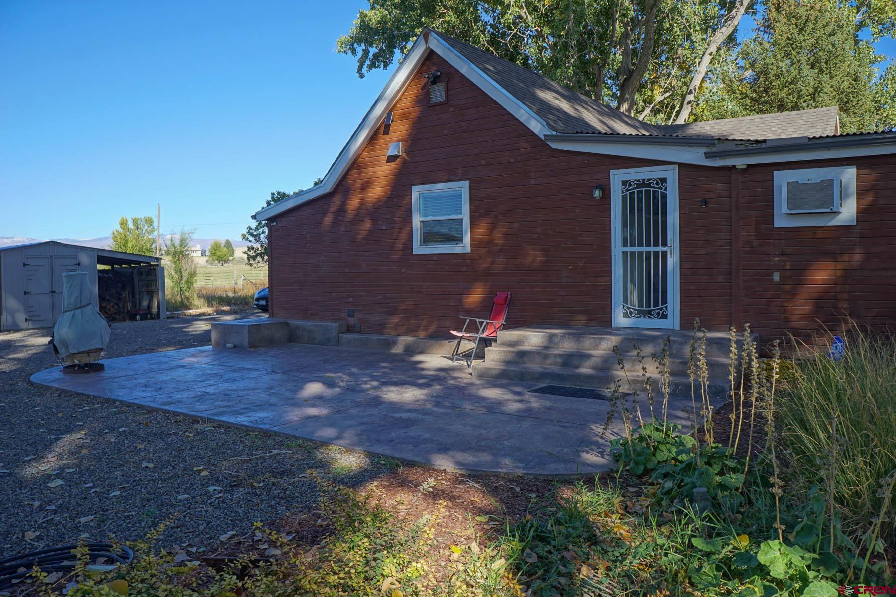 6733 2050th Road Delta, CO 81416 - Photo 23 of 32 a front view of house with yard