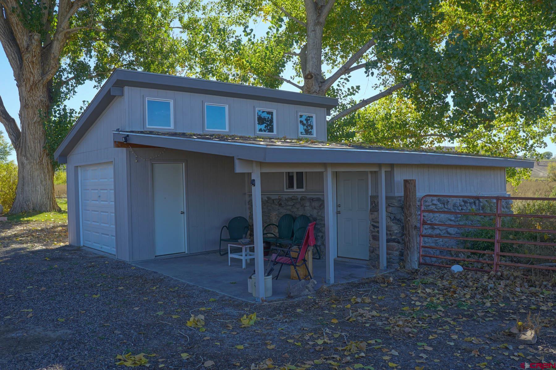 6733 2050th Road Delta, CO 81416 - Photo 25 of 32 a view of a house with a backyard