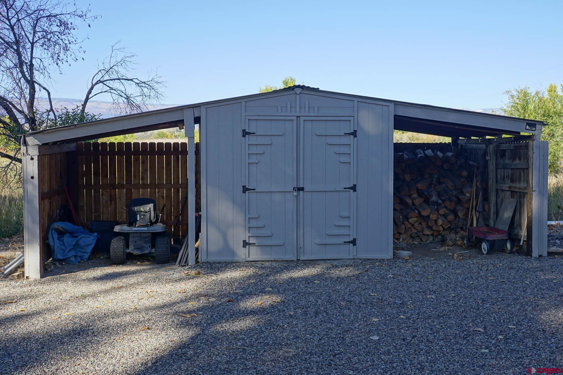 6733 2050th Road Delta, CO 81416 - Photo 29 of 32 a view of a house with a door and wooden roof