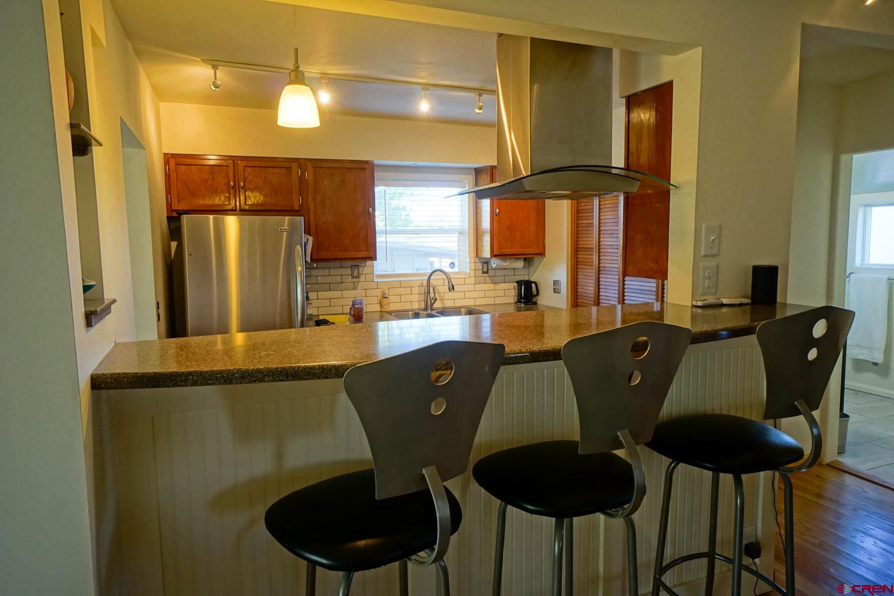 6733 2050th Road Delta, CO 81416 - Photo 10 of 32 a view of a dining room with furniture and window
