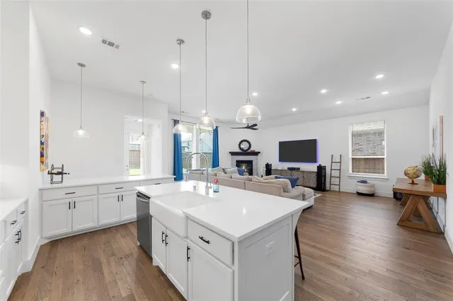 a bedroom with furniture and flat screen tv