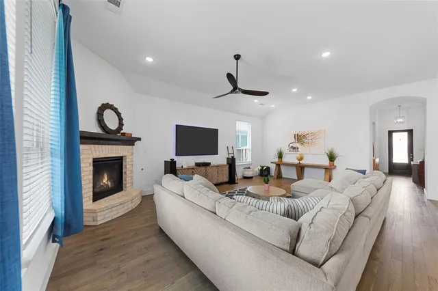 a kitchen with stainless steel appliances granite countertop a kitchen island a stove a table and chairs