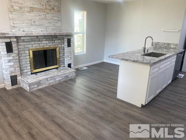 640 Morrill Avenue Reno, NV 89512 - Photo 4 of 15 a kitchen with a sink and a fireplace