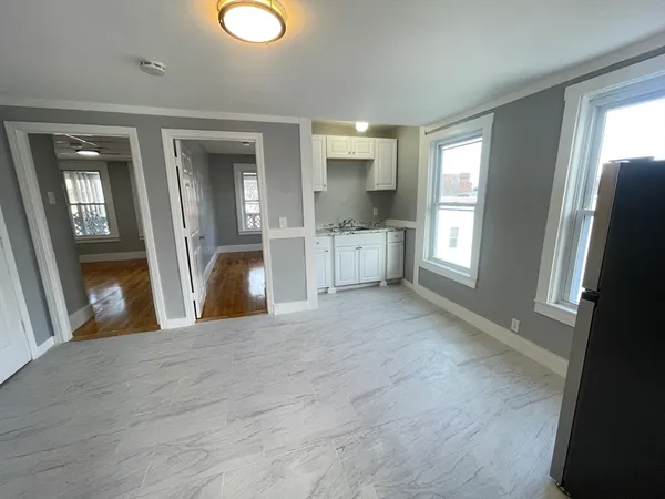 a view of a kitchen cabinets and wooden floor