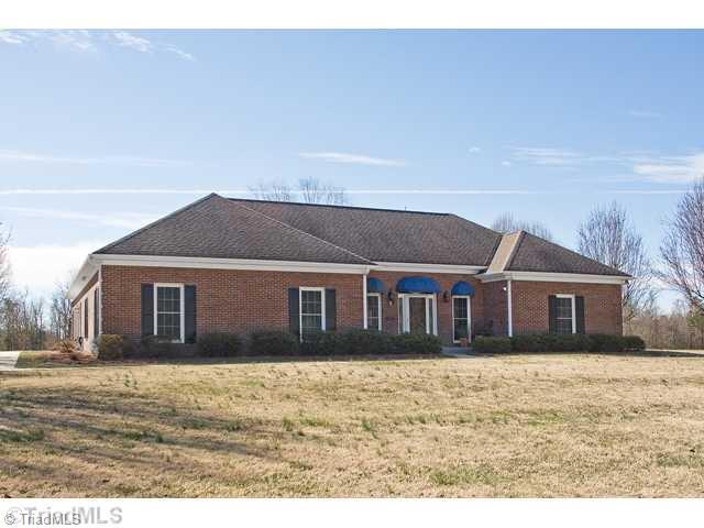 1031 Sutton Road Greensboro, NC 27406 - Photo 1 of 16 Exterior Front. Beautiful all brick home one level living with bonus room on upper level.