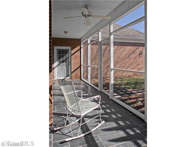 1031 Sutton Road Greensboro, NC 27406 - Photo 10 of 16 Screened Porch. What a peaceful spot to sit and enjoy the day! You have convenient access from great room, master bedroom, and garage