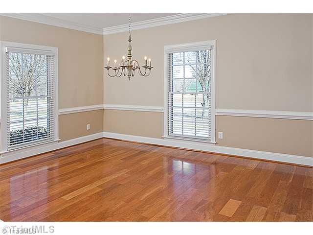 1031 Sutton Road Greensboro, NC 27406 - Photo 4 of 16 Dining Room. Large dining room with new light fixture and beautiful hardwood floors. All recently painted and ready for a new family. Must see this home.