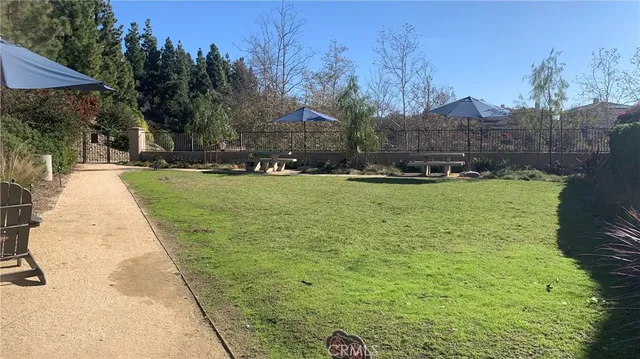 a view of a swimming pool with a yard