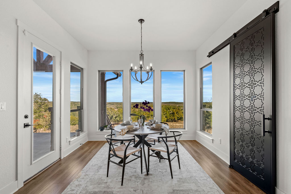 213 Lets Roll Drive Fischer, TX 78623 - Photo 20 of 38 a view of a dining room with furniture window and outside view