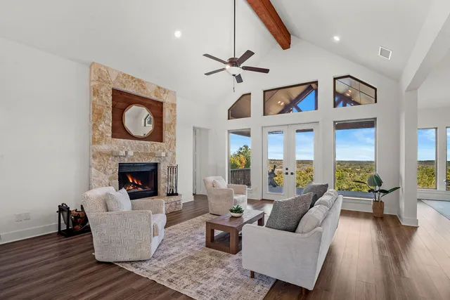 a living room with furniture and a fireplace