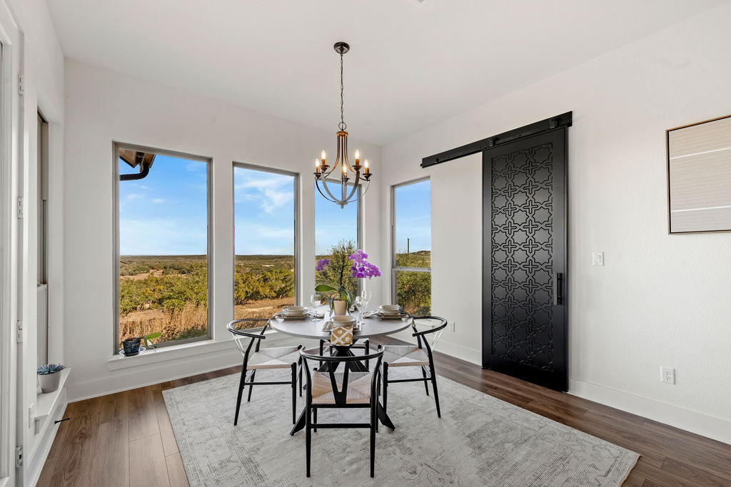 213 Lets Roll Drive Fischer, TX 78623 - Photo 21 of 38 a view of a livingroom with furniture window and wooden floor