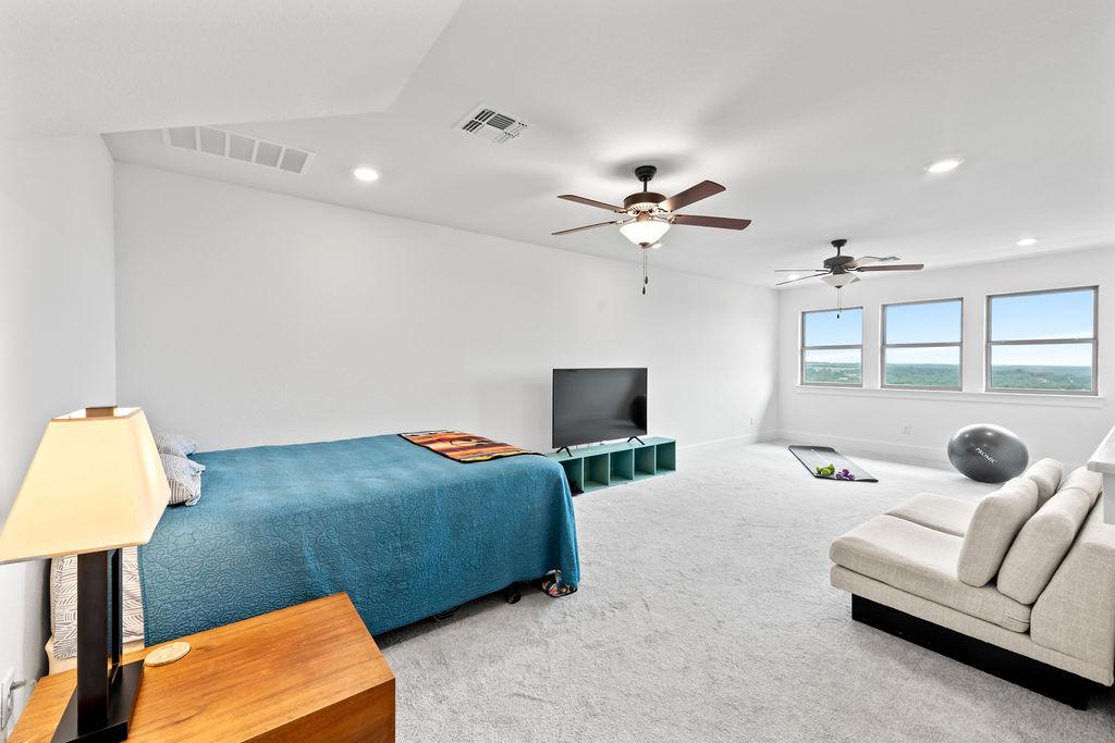 213 Lets Roll Drive Fischer, TX 78623 - Photo 30 of 38 Living room with carpet, recessed lighting, ceiling fan, and baseboards