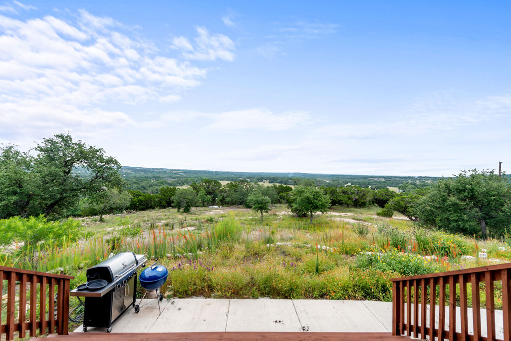 213 Lets Roll Drive Fischer, TX 78623 - Photo 35 of 38 View of yard with a wooden deck