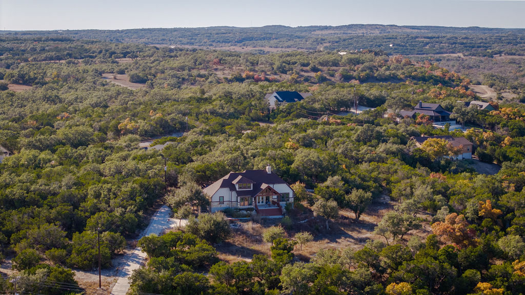213 Lets Roll Drive Fischer, TX 78623 - Photo 37 of 38 an aerial view of a house with a outdoor space