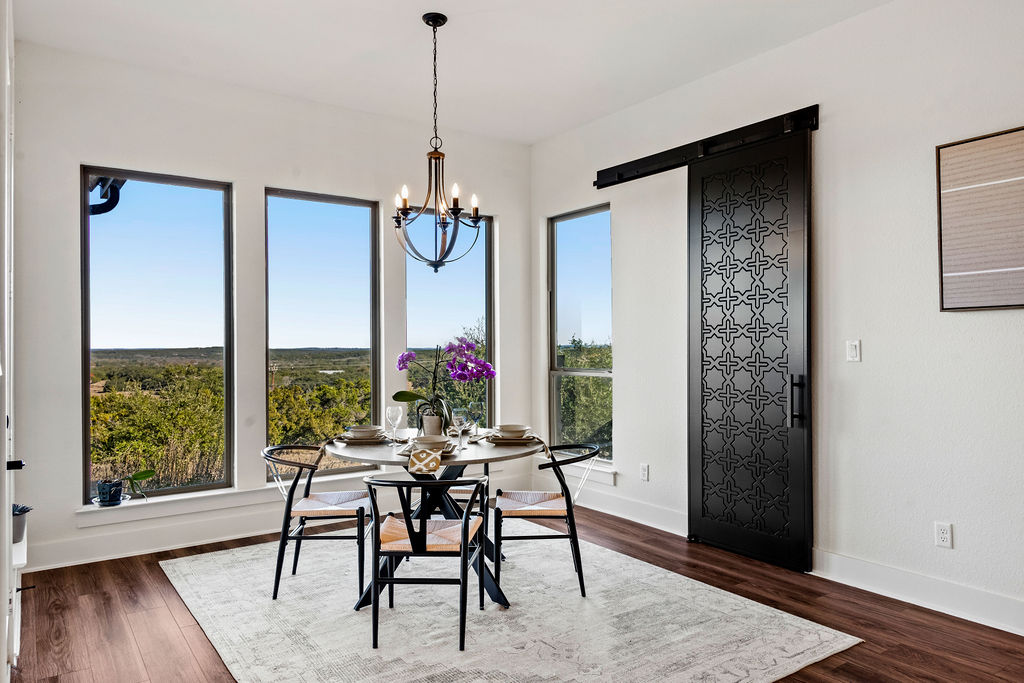 213 Lets Roll Drive Fischer, TX 78623 - Photo 4 of 38 a view of a dining room with furniture window and wooden floor