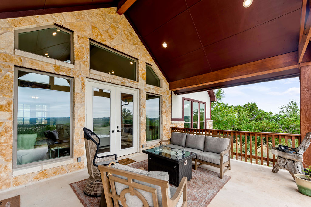 213 Lets Roll Drive Fischer, TX 78623 - Photo 8 of 38 a outdoor space with patio the couches and a dining table with the view of the balcony