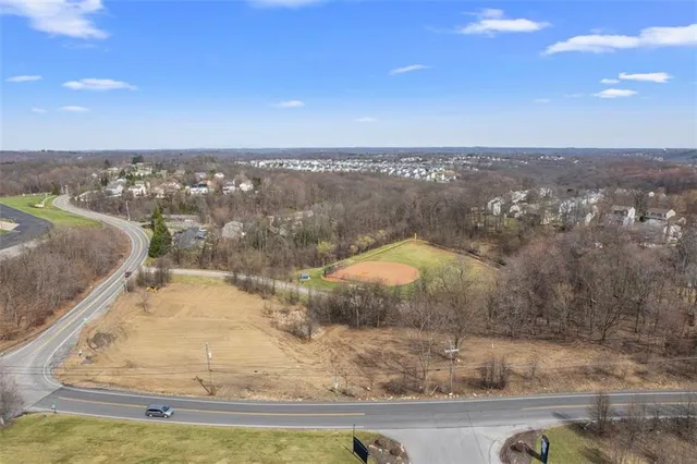 a view of a swimming pool with a yard