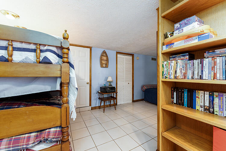 392 Lakeview Point Road Harrodsburg, KY 40330 - Photo 22 of 38 The basement is set up for several sleeping arrangements along with a full bath and utility room.