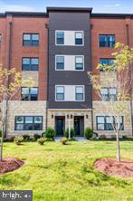 44782 Tiverton Square Ashburn, VA 20147 - Photo 1 of 26 a house view with swimming pool in front of it