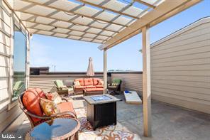 44782 Tiverton Square Ashburn, VA 20147 - Photo 12 of 26 a view of balcony with couch and chairs