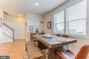 44782 Tiverton Square Ashburn, VA 20147 - Photo 6 of 26 a view of a dining table and chairs in a room
