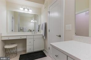 44782 Tiverton Square Ashburn, VA 20147 - Photo 9 of 26 a bathroom with a sink a vanity and a mirror